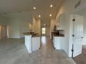 Open-concept kitchen with stainless steel appliances and ample counter space at 416 Central Ave, Frostproof, FL 33843