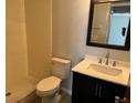 Updated bathroom with a walk-in shower, new vanity, and tile flooring at 940 Fenton Ln # 16, Lakeland, FL 33809