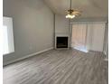 Spacious living room featuring a fireplace and vinyl plank flooring at 940 Fenton Ln # 16, Lakeland, FL 33809