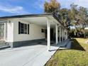 A spacious carport provides ample covered parking for your vehicles and convenience at 102 Willow Ln, Leesburg, FL 34748