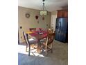 Cozy dining area with a wooden table set and natural light at 1273 Tyler Lake Cir, Orlando, FL 32839