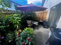 Cozy outdoor patio area with umbrella, perfect for relaxing and entertaining at 1608 Long Ridge Ct # 274, Orlando, FL 32807