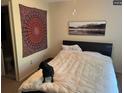 Bedroom with a double bed, wall art, and dog at 255 Sandlewood Trl # 4, Winter Park, FL 32789