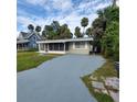 Charming house with a long driveway and tropical landscaping at 325 Garden St, Daytona Beach, FL 32114