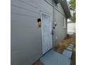 Side entrance with security door and pathway at 325 Garden St, Daytona Beach, FL 32114