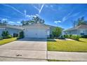 Two-car garage and a well-maintained lawn at 4481 Reding Way, Lakeland, FL 33813