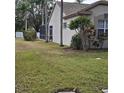 View of house showcasing a screened patio area at 766 Bryson Loop, Lakeland, FL 33809