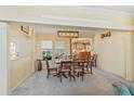 Dining room with hardwood floors and view into kitchen at 108 Dogwood Trl, Leesburg, FL 34748