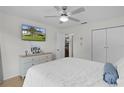 Bright bedroom with large window, ceiling fan, and neutral decor offers a relaxing retreat at 1411 Juarez Pl, The Villages, FL 32159
