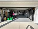 Spacious two-car garage with ample storage, shelving, and laundry area at 1618 Juno Trail, Astor, FL 32102