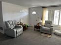 Cozy living room with comfortable seating and natural light at 1618 Juno Trail, Astor, FL 32102