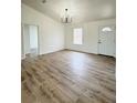 Spacious living room with hardwood floors and chandelier at 203 Juniper Way, Ocala, FL 34480