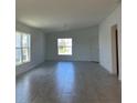 Bright living room featuring tile floors, recessed lighting, and large windows at 277 Harper Estates Cir, Lake Wales, FL 33859