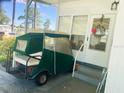Golf cart parked near the entrance of a manufactured home at 408 Hawthorne Blvd, Leesburg, FL 34748