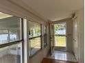 Inviting entryway with tile flooring, and a view of the waterfront at 55808 Nan Dr, Astor, FL 32102