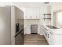 Newly renovated kitchen boasting stainless steel appliances, white cabinetry, and stunning countertop at 708 Wynn Dr, Sanford, FL 32773