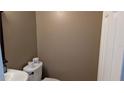 Neutral half bathroom features a toilet and sink at 1617 Shady Ridge Ct # 257, Orlando, FL 32807