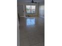 Large tile flooring in the living room with natural light at 1617 Shady Ridge Ct # 257, Orlando, FL 32807