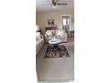 Cozy living room with comfortable seating and a stylish rug, perfect for relaxing and entertaining guests at 225 E Cummings St, Lake Alfred, FL 33850
