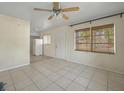 Inviting living room features tile floors, natural light, and a view into the kitchen area at 2403 Nansen Ave, Orlando, FL 32817