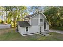 Home's exterior with new landscaping and spacious surrounding grounds at 2449 E Lake Dr, Deland, FL 32724