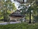 The entrance to the community has a covered entrance with stone pillars at 25879 Crossings Bluff Ln, Sorrento, FL 32776