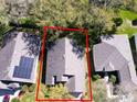 An aerial view showcases this single-Gathering home's roof and landscaping at 3623 Eversholt St, Clermont, FL 34711