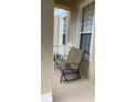 Comfortable outdoor seating area on the porch, perfect for relaxing at 7117 Red Lantern Dr # 7117, Harmony, FL 34773