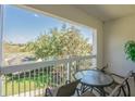 Enjoy the view from this private balcony with a table and chairs perfect for relaxing outdoors at 7697 Heritage Crossing Way # 302, Reunion, FL 34747
