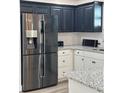 Modern kitchen featuring stainless steel appliances, granite countertops, and elegant cabinetry at 906 Se 3Rd St, Mulberry, FL 33860