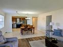 Open-concept living room and kitchen offer a bright and airy space with plenty of room at 1640 Juno Trl # 101A, Astor, FL 32102