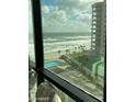 Enjoy ocean views from this condo featuring a pool, the beach, and a neighboring highrise at 1909 S Atlantic Ave # 703, Daytona Beach, FL 32118
