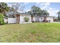Attractive single Gathering home featuring stone accents and a spacious front lawn at 1928 South Blvd, Maitland, FL 32751