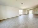 Expansive living room featuring stylish tile flooring and abundant natural light through large windows at 2117 Lincoln Ln, Bartow, FL 33830