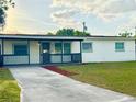 Charming single-story home with a well-maintained lawn and long driveway at 2336 Nansen Ave, Orlando, FL 32817
