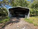 Carport providing sheltered parking at 24047 Ermine Rd, Astor, FL 32102