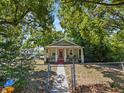 Inviting single-story home with a fenced yard and charming front porch at 302 W Park St, Lakeland, FL 33803