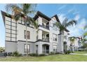 Attractive condo building featuring a well-kept lawn and a clean, modern facade at 5526 P G A Blvd # 4911, Orlando, FL 32839