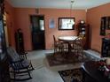 Charming dining room features a round table, wooden chairs, and a decorative rug at 6832 Oswego Dr, Mount Dora, FL 32757