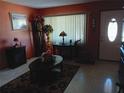 Cozy living room featuring warm colors, decorative furnishings, and a welcoming ambiance at 6832 Oswego Dr, Mount Dora, FL 32757
