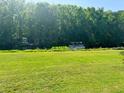 Picturesque backyard overlooking a canal with boat dock and lush greenery at 106 Palo Verde Dr, Leesburg, FL 34748