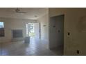 Bright living room with a fireplace, tile flooring and neutral walls at 4202 Sunny View Dr, Lakeland, FL 33813