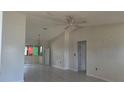 Spacious living room featuring tile flooring and a ceiling fan at 4202 Sunny View Dr, Lakeland, FL 33813