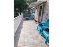 Spacious front porch with tiled flooring and comfortable seating, perfect for relaxing outdoors at 4814 Myrtle View N Dr, Mulberry, FL 33860