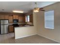 Eat-in kitchen features modern appliances, lots of cabinets, and natural light at 1810 Centennial Ave, St Cloud, FL 34769