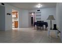 Bright living room featuring tile flooring, open layout, and easy access to the kitchen and other areas at 2408 Lemon Tree Ln # C, Orlando, FL 32839