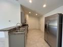 Modern kitchen equipped with stainless steel appliances and plenty of counter space at 280 Harper Estates Cir, Lake Wales, FL 33859