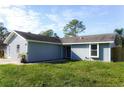 Inviting single-story home with a well-maintained lawn, offering a glimpse of comfortable suburban living at 3426 Somerset Ave, Deltona, FL 32738