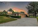 Detached two-car garage with decorative accents and a spacious driveway at 39342 Harbor Hills Blvd, Lady Lake, FL 32159