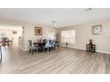 Bright dining room with modern flooring, neutral walls, and a decorative dining table at 709 Crystal Bay Ln, Orlando, FL 32828